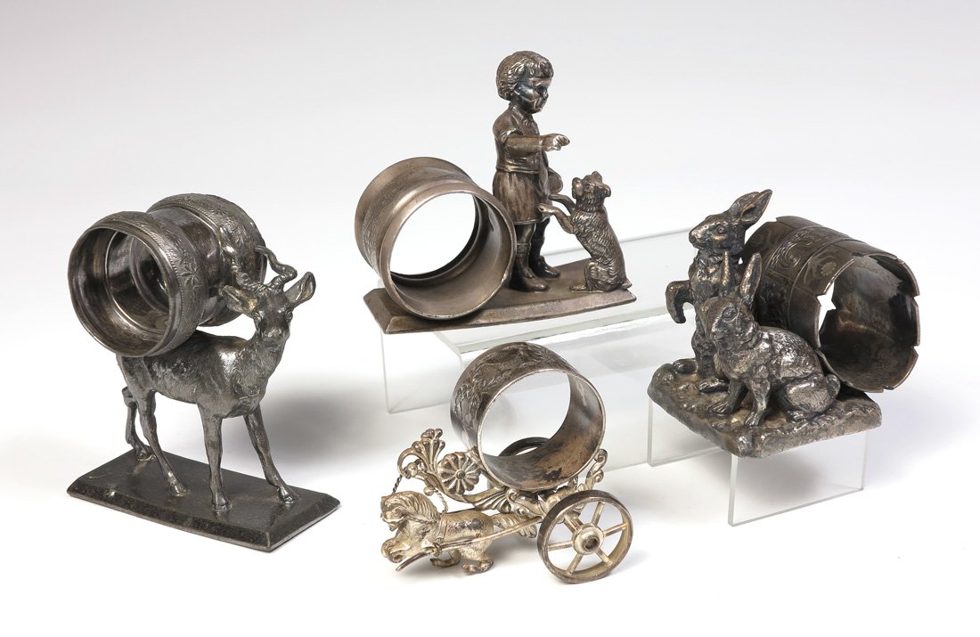 4 FIGURAL ANIMAL SILVERPLATE NAPKIN RINGS: 4 FIGURAL ANIMAL SILVERPLATE NAPKIN RINGS: 4 total pieces to include 1) Meriden antelope, ring on back, #204. 4" h. 2) Pairpoint 2 rabbits, ring as log on back, ring is out of round, #683, 2 3/4". 3) 