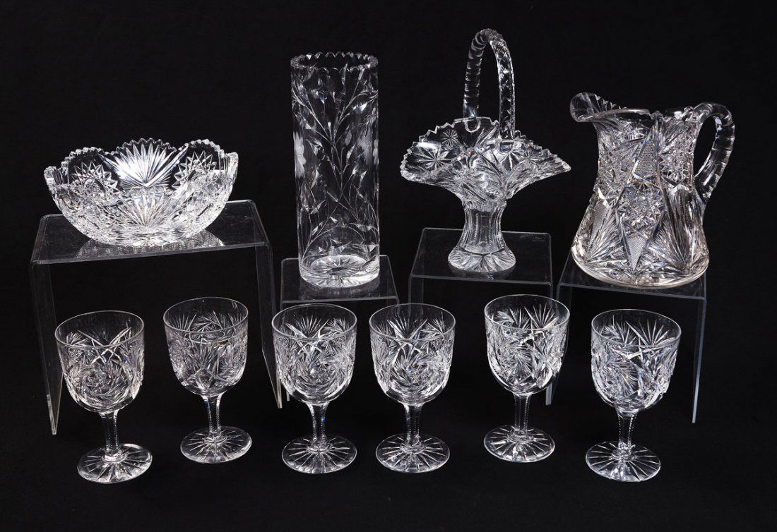 10 PIECE CUT GLASS COLLECTION: 10 PIECE CUT GLASS COLLECTION: An assembled collection to include 1) Pitcher 8" h. x 8 3/4". 2) Tall vase 10" h. x 3 3/4". 3) Brides basket, 10 1/2" h. x 7 1/2". 4) Bowl, 3 1/4" h. x 8 1/4". 5) 6 wate