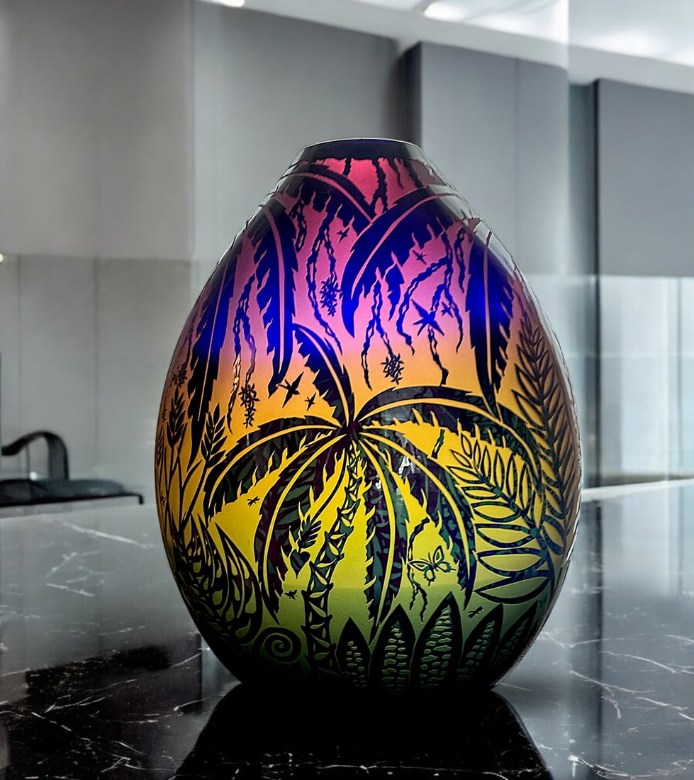 DUNCAN MCCLELLAN "JUNGLE" ART GLASS VASE: McCLELLAN, Duncan, (American, b. 1955): Monumental art glass vase, Etched and sculpted with Palm Trees, Vines, Butterflies, Birds, & Ferns. Etched signature at the underside. Approx. 20.5" h x 16" w x