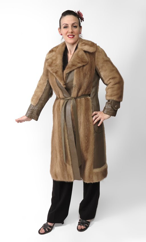 VINTAGE 1970'S MINK & LEATHER COAT: VINTAGE 1970'S MINK & LEATHER COAT: Mink with leather side panels, tie belt and cuffs. Length approx. 41". Cool paisley lining. Steins Furs of Distinction, Wilkes Barr PA label.