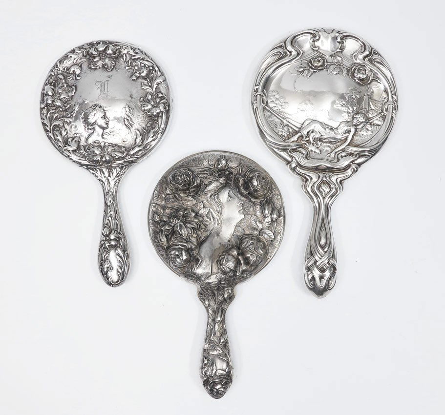 3 FOSTER & BAILEY ART NOUVEAU STERLING HAND MIRROR: 3 FOSTER & BAILEY ART NOUVEAU STERLING HAND MIRRORS: 3 pieces total, all by Foster & Bailey to include 1) Woman lying in hammock with farm scene behind. 10 1/4'' long. 2) Woman with bird on head and r