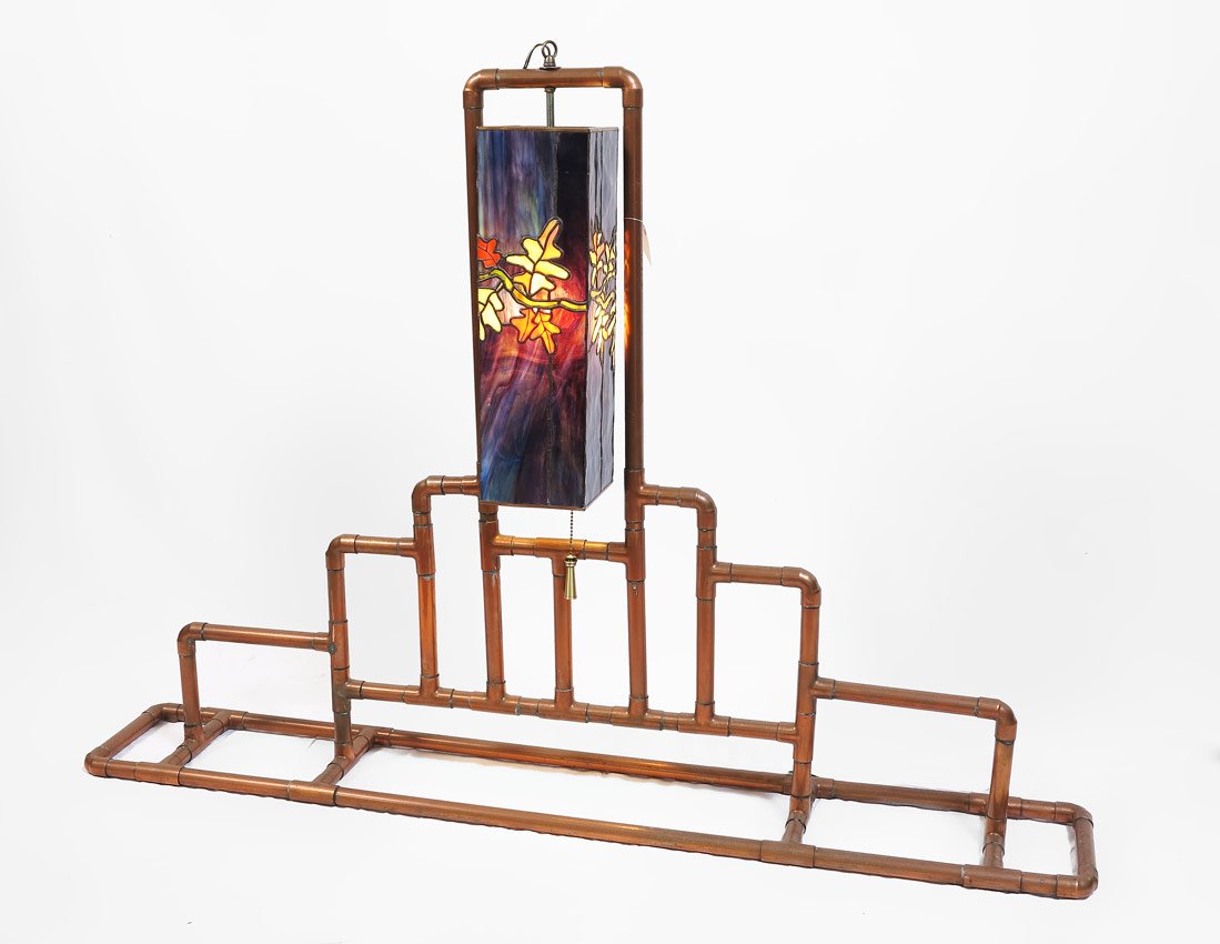 RIVERBEND STUDIOS COPPER AND LEADED GLASS LAMP: RIVERBEND STUDIOS COPPER & LEADED GLASS LAMP: Designed by Riverbend Studio's, Denver, Colorado. Single light with floral motif shade. 31 1/4" h. x 51" x 8 1/4".