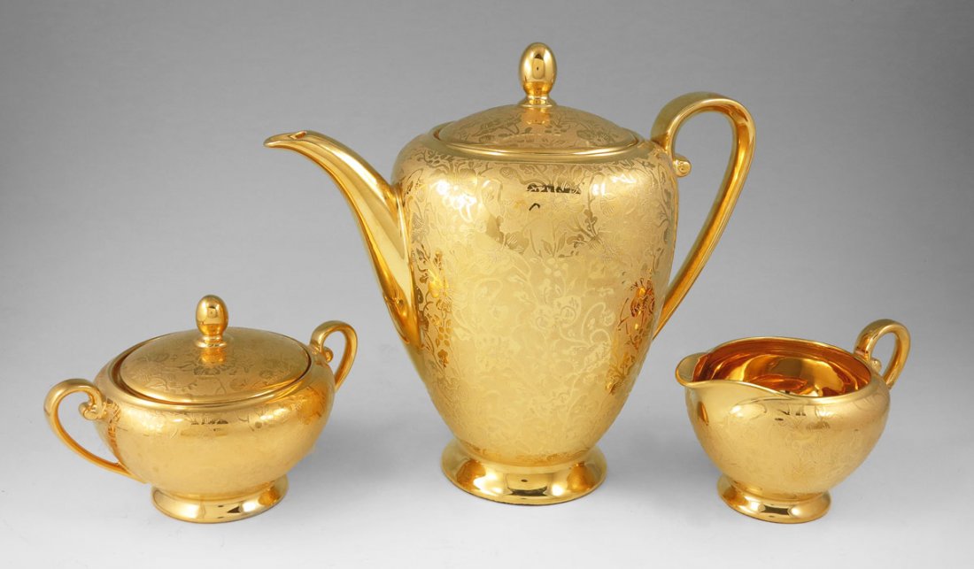 TIRSCHENREUTH BAVARIAN GILT PORCELAIN COFFEE SET: TIRSCHENREUTH BAVARIAN GILT PORCELAIN COFFEE SET: 3 piece set with all over gilt floral design. The pot measures 9" tall.