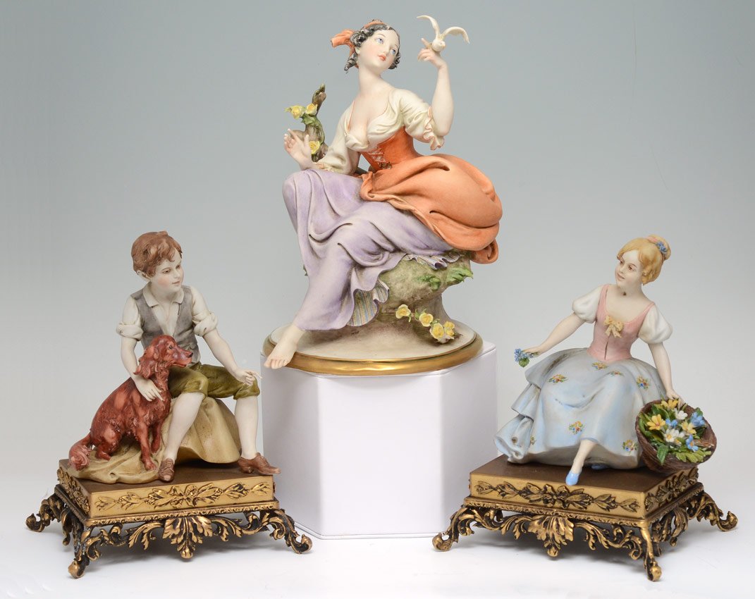 3 pc ITALIAN PORCELAIN FIGURINES CAPPE: 3 ITALIAN PORCELAIN FIGURINES: G. Cappe woman with bird, 89038, approx. 9" tall x 6". Sold together with a young man and girl on metal base, 8" x 5 1/2.