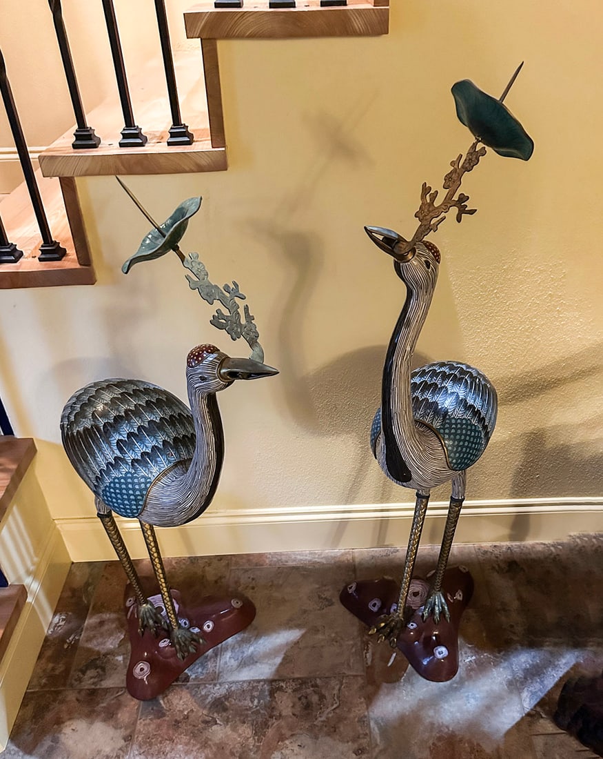 PR. CHINESE CLOISONNE CRANE CANDLE PRICKS: PR. CHINESE CLOISONNE CRANE CANDLE PRICKS: A fine pair of Chinese Cloisonne Candle pricks with lidded compartments on their backs. Blue ground with colorful details. Mounted on a tree stump form base.