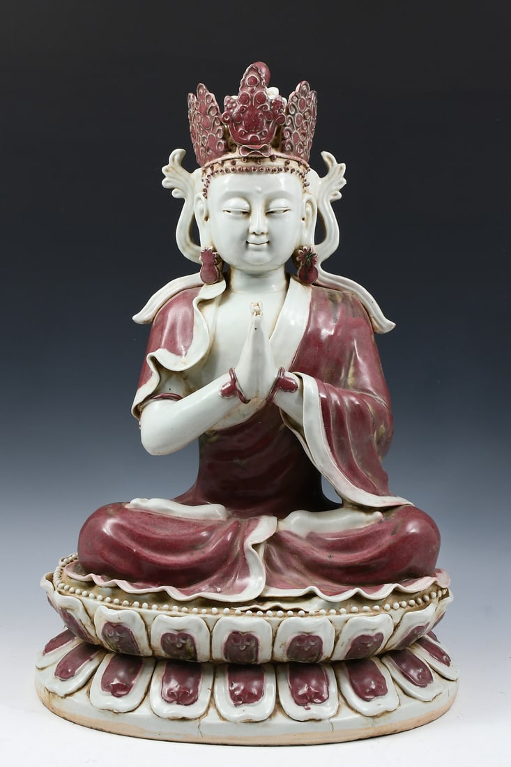 CHINESE COPPER RED PORCELAIN GUANYIN: CHINESE COPPER RED PORCELAIN GUANYIN: Chinese Ming style porcelain Guanyin seated in a meditative position on a double-Lotus base with attached petals & a beaded border. Approx. 20.5" h x 14" w x 10"d