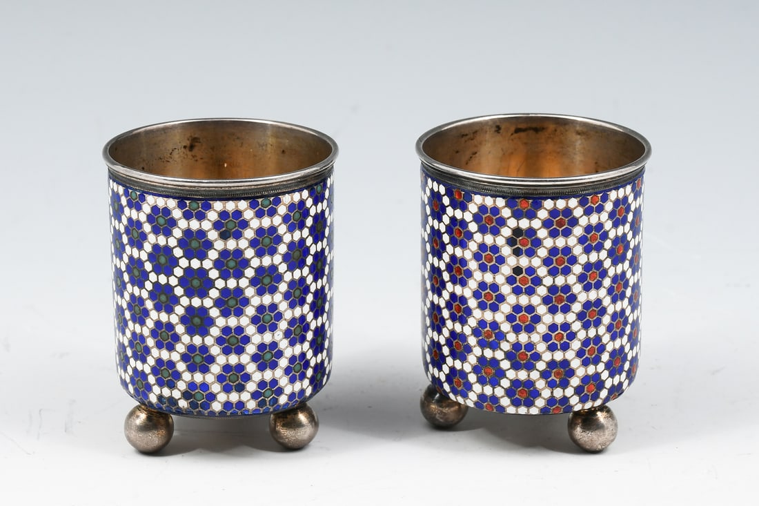 2 RUSSIAN ENAMELED SILVER FOR TIFFANY FOOTED CUPS: 2 RUSSIAN ENAMELED SILVER FOR TIFFANY FOOTED CUPS: Two finely enameled Russian cups for Tiffany, having a stylized floral pattern with each cup having different colors in center of flowers. Both raise