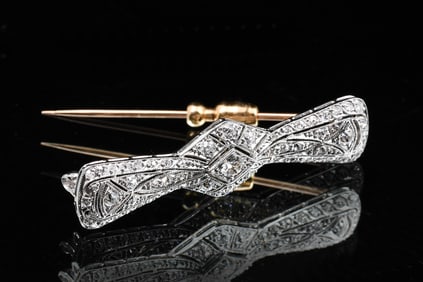 CA. 1920'S PLATINUM/18K DIAMOND BOW SHAPED BROOCH