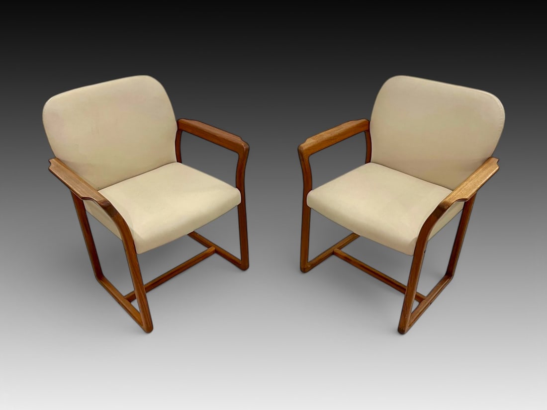 PR. DANISH MODERN BENNY LINDEN TEAK ARMCHAIRS: PR. DANISH MODERN BENNY LINDEN TEAK ARMCHAIRS: Pair of Mid-Century Modern Teak Armchairs, upholstered in an off-white Leather. Approx. 32" h x 26.375" w x 23.75" d.