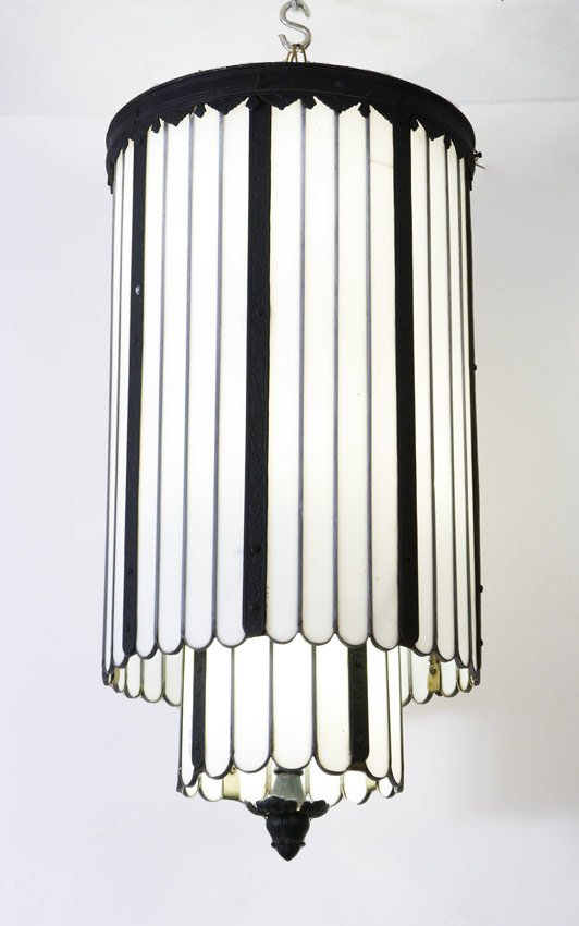 2 TIER ART DECO CEILING LIGHT: 2 TIER ART DECO CEILING LIGHT: 2 level, 12 light fixtures with white glass panels and embossed metal frame. 32 1/2'' h. x 15 3/4'' dia.