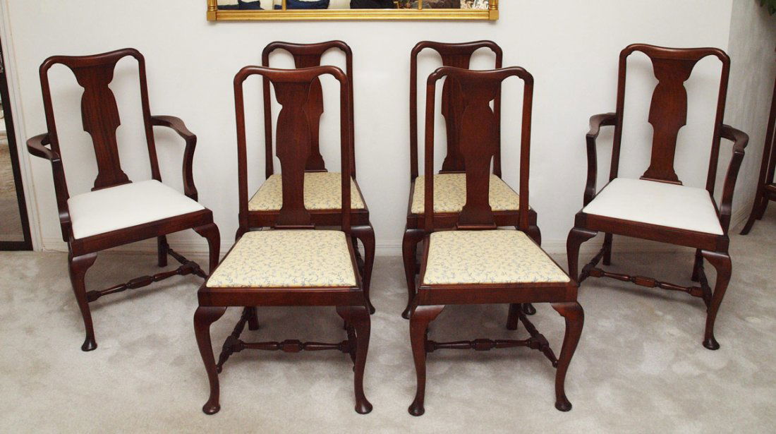SET OF 6 QUEEN ANNE DINING CHAIRS: SET OF 6 QUEEN ANNE DINING CHAIRS: Shaped back with cabriole front legs, turned stretchers. 2 arm chairs with white cushions 42" h. x 25 1/4" x 22 1/4", 4 side chairs with foliate upholstery.
