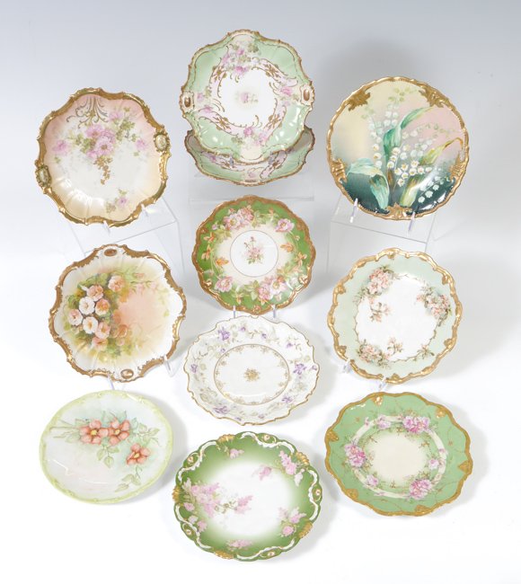 GROUP OF 11 FRENCH LIMOGES CABINET PLATES: GROUP OF 11 FRENCH LIMOGES CABINET PLATES: Ca. 1891-1914. Marked with the green star mark of Coiffe. 8 1/2" dia. Some are handpainted, all decorated in a unique floral design with ornate border.