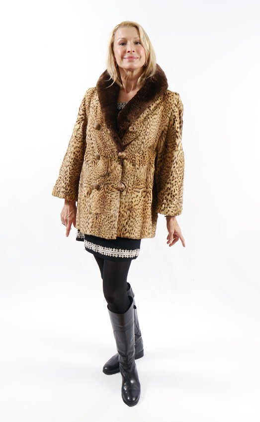 VINTAGE LEOPARD SPOT GEOFREY CAT FUR JACKET: VINTAGE GEOFFREY CAT FUR JACKET: Spotted fur jacket with long brown fur collar, double rows of buttons. Approx. measurements are length from collar to hem, 28". Shoulder to shoulder, 18", shoulder to 