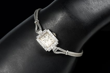 PLATINUM AND DIAMOND WATCH BY RENAUD