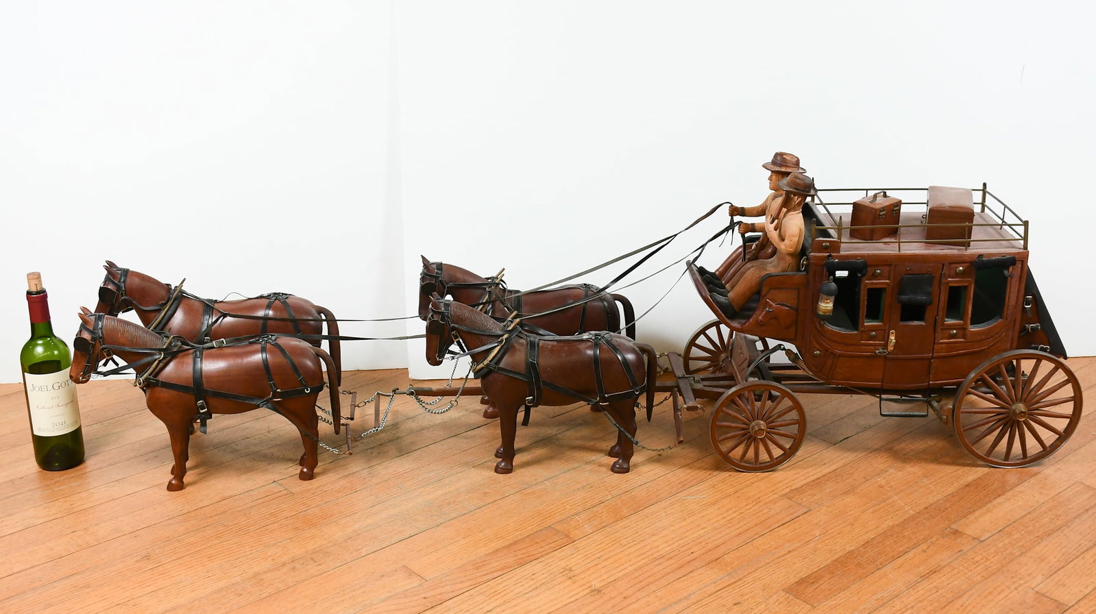 LARGE CECIL PICKETT HAND-CARVED WOODEN STAGECOACH: LARGE CECIL PICKETT HAND-CARVED WOODEN STAGECOACH: Complete with a team of four horses, driver, and shotgun. 64” in length overall, 20” in height.