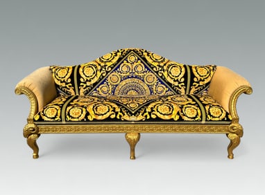 CARVED & GILT VERSACE UPHOLSTERED RAM'S HEAD SOFA
