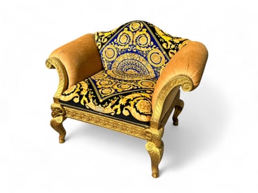 OVERSIZED CARVED & GILT VERSACE UPHOLSTERED CHAIR