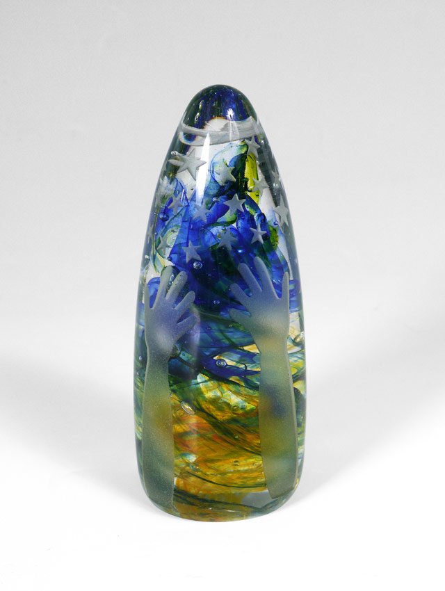 DUNCAN MCCLELLAN REACH FOR THE STARS PAPERWEIGHT: DUNCAN MCCLELLAN REACH FOR THE STARS PAPERWEIGHT: With blue and amber internal swirls, etched glass hands and arms with stars. Signed at base. 6'' h.