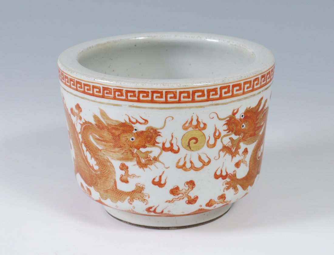 CHINESE EXPORT IRON RED DRAGON POT: CHINESE EXPORT IRON RED DRAGON POT: Dragon and fire motifs with other oriental decoration. Guangxu period underglaze marks on base. 5" h. x 6 3/4". Actual age unknown.