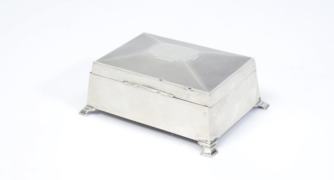 1864 ENGLISH STERLING HUMIDOR: 1864 ENGLISH STERLING HUMIDOR: Unknown maker W.A, with 1864 Birmingham hallmarks. Hinged lid with stippled design on top, wood lined interior, on 4 feet. Measures 2 1/2'' h. x 6 1/8'' x 4 1/2''.