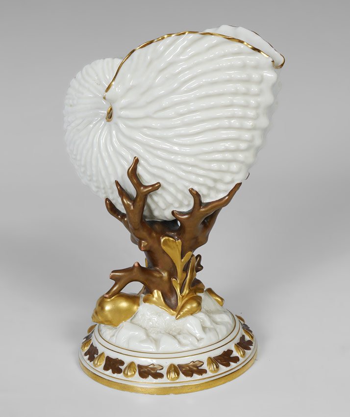 ROYAL WORCESTER SHELL NAUTILUS SHELL CA. 1887: ROYAL WORCESTER NAUTILUS SHELL CA. 1887: Parcel gilt fine porcelain vase depicting a nautilus shell being held by coral. Worcester date mark for 1887. 8 1/2" tall x 6".