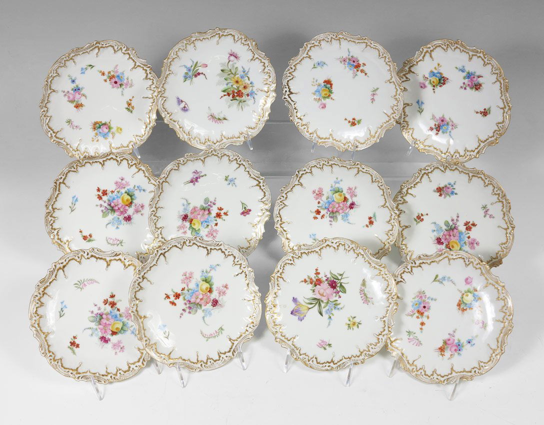 SET OF 12 FRENCH LIMOGES PLATES, CA. 1891-1914: SET OF 12 FRENCH LIMOGES FLOWER DECORATED FINE PORCELAIN PLATES: From the factory of Coiffe, CA. 1891-1914. Embossed and gold decorated rims. Approx. 7 1/2" dia.