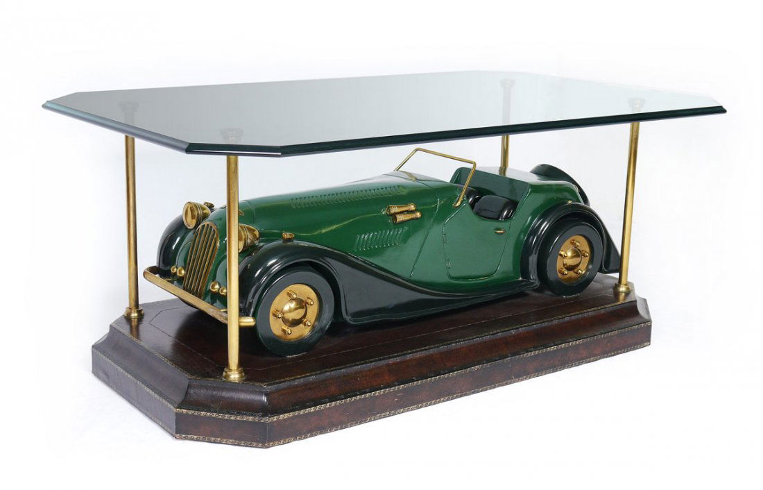 MAITLAND SMITH ENGLISH ROADSTER BASE COFFEE TABLE: MAITLAND SMITH ENGLISH ROADSTER BASE COFFEE TABLE: Glass top with base featuring a scale model of an English roadster car. Limited edition table by Maitland-Smith, perfect for a man cave. Overall meas