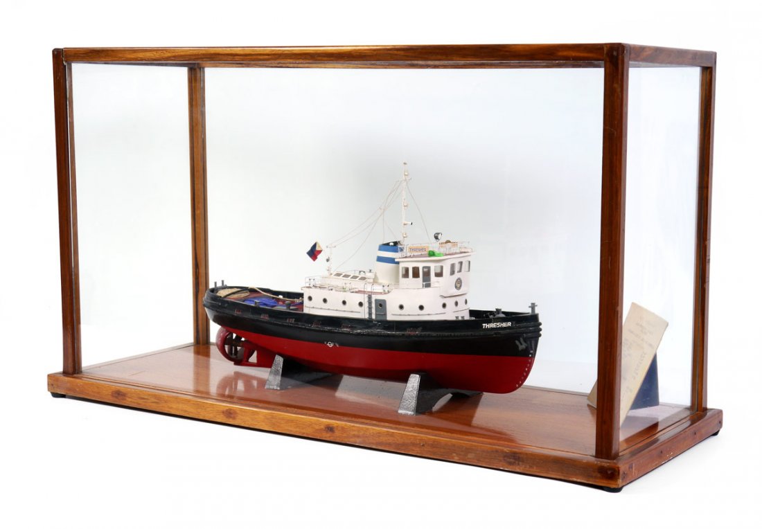 HANDCRAFTED SCALE MODEL OF THE TUGBOAT THRESHER: HANDCRAFTED SCALE MODEL OF THE TUGBOAT THRESHER: In oak framed display case, handmade scale model of the M/T Thresher by Luzon Stevedoring Corp., Hull #35. Designed and built by Iloilo dock & Engineer