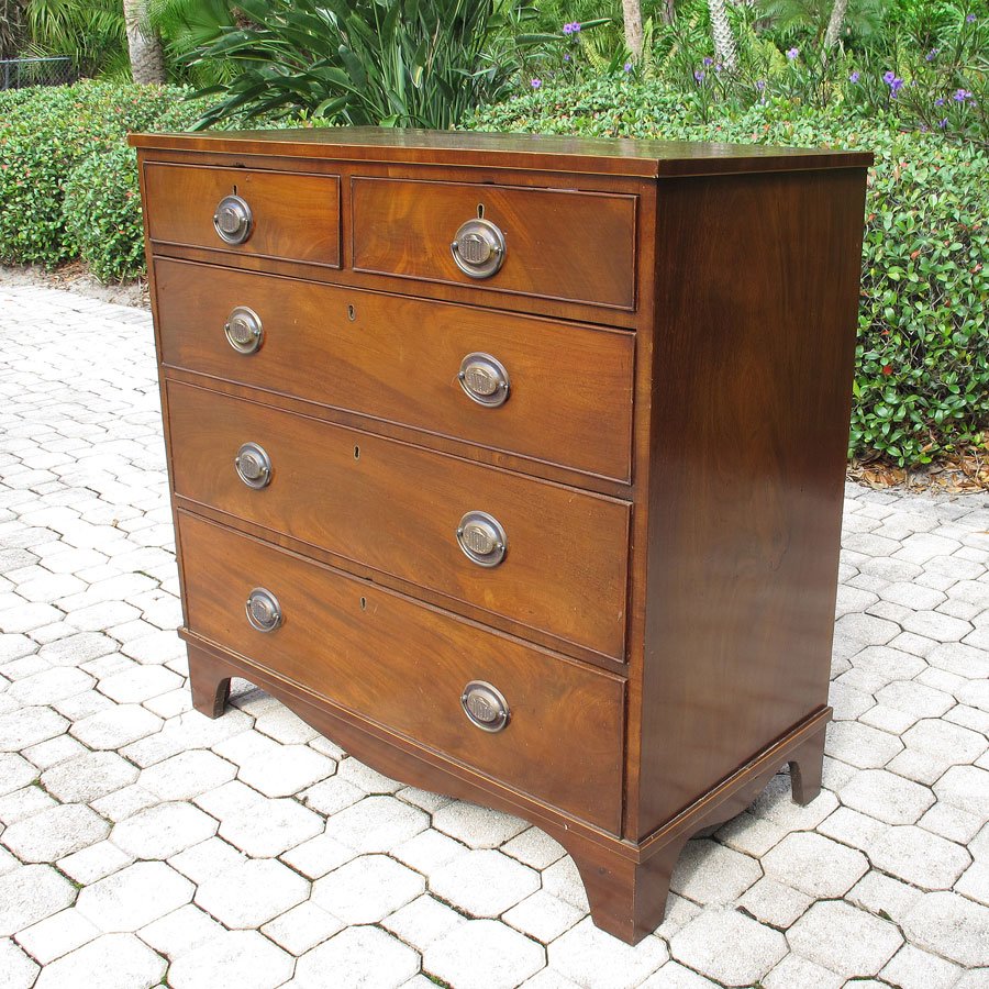 EARLY 19TH CENTURY HEPPLEWHITE CHEST: EARLY 19TH CENTURY HEPPLEWHITE CHEST: Mahogany with string inlay accents, 2 half drawers over 3 graduated full length drawers, embossed brass pulls. Shaped shirt, on 4 feet. 39 1/2" h. x 40 1/2" x 19 