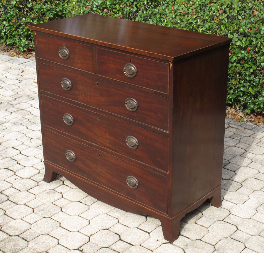 EARLY 19TH CENTURY HEPPLEWHITE CHEST: EARLY 19TH CENTURY HEPPLEWHITE CHEST: Mahogany with string inlay accents, 2 half drawers over 3 graduated full length drawers, embossed brass pulls. Shaped shirt, on 4 feet. 39 3/4" h. x 42" x 19 1/2"