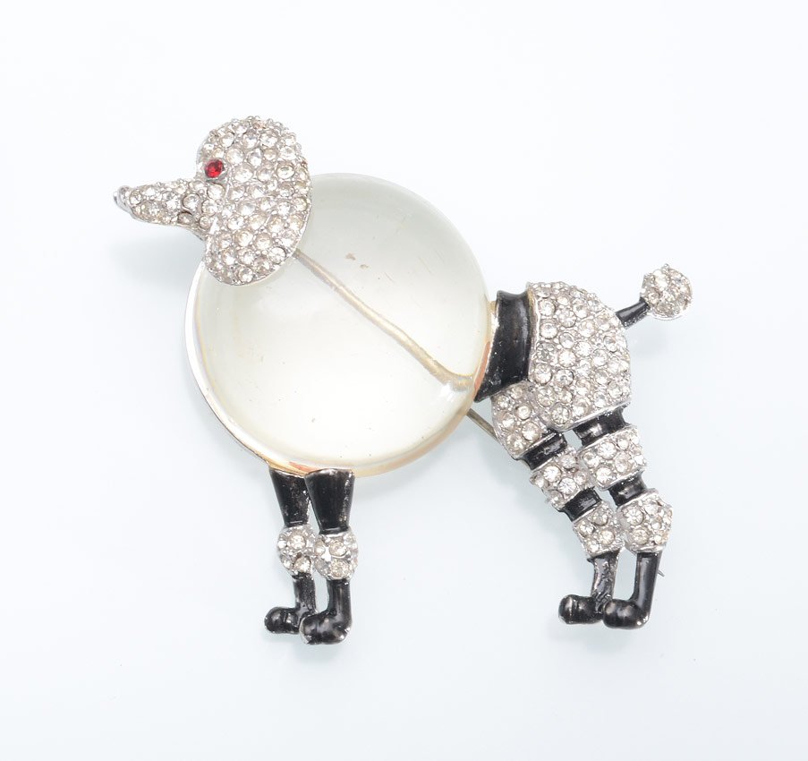 TRIFARI JELLY BELLY POODLE BROOCH PIN: TRIFARI JELLY BELLY POODLE BROOCH PIN: Lucite body with black enamel and rhinestone. Unmarked, does have Pat. Pend. stamp. 2 1/4" h. x 2 3/4" l.