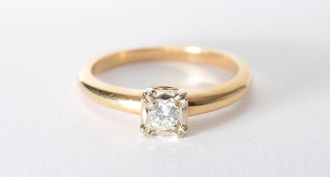 DIAMOND SOLITAIRE ENGAGEMENT RING SZ 7: DIAMOND SOLITAIRE ENGAGEMENT RING: 14K yellow gold ring contains one round brilliant cut diamond. Weight: .15 Ct. Approx. Rated VS1 in clarity and G in color. The diamond is prong set. Weight: 2.9 gra