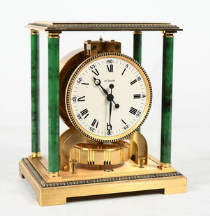 LE COULTRE ATMOS PERPETUAL MOTION 15 JEWEL CLOCK: LE COULTRE ATMOS PERPETUAL MOTION 15 JEWEL CLOCK: Serial #313554, Le Coultre Atmos perpetual motion mantel clock with 15 Jewels. Gold toned brass case with Malachite painted corner columns. Approx.