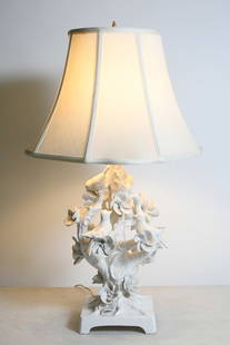 ITALIAN MAJOLICA PORCELAIN BIRD LAMP: ITALIAN MAJOLICA PORCELAIN BIRD LAMP: An Italian White glazed Blossoming Tree form table lamp with several perched Birds. "8951, Made in Italy at the underside. Surmounted by a cloth shade. Approx.