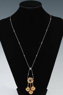 EXOTIC 18K PLAT AMETHYST DIAMOND LAVALIER NECKLACE: EXOTIC 18K PLAT AMETHYST DIAMOND LAVALIER NECKLACE: An exotic lavaliere necklace crafted from 18k yellow gold, suspended from a platinum chain, containing 4 round mixed cut amethysts. TOTAL AMETHYST