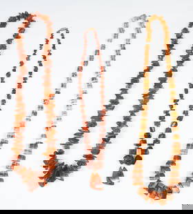 3 AMBER NECKLACES W/ 14K GOLD: 3 AMBER NECKLACES W/ 14K GOLD: A trio of amber necklaces of varied styles and colors. 1) A continuous strand of graduated nuggets of Baltic amber. Length: approx. 29". Weight: approx. 124.4 grams. 2)