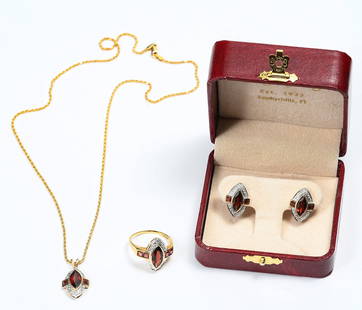 DELIGHTFUL 14K GOLD GARNET SUITE: DELIGHTFUL 14K GOLD GARNET SUITE: This lovely 14k bi-color gold suite consists of a pendant created with a marquis cut garnet flanked by square cut garnets on either side suspended on a 14K yellow