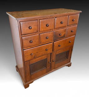 19TH CENTURY AMERICAN APOTHECARY CHEST: 19TH CENTURY AMERICAN APOTHECARY CHEST: Ten drawers over two doors, all with turned pulls. Raised on Ogee Bracket feet. Approx. 50.375" h x 46.75" w x 22.25" d.