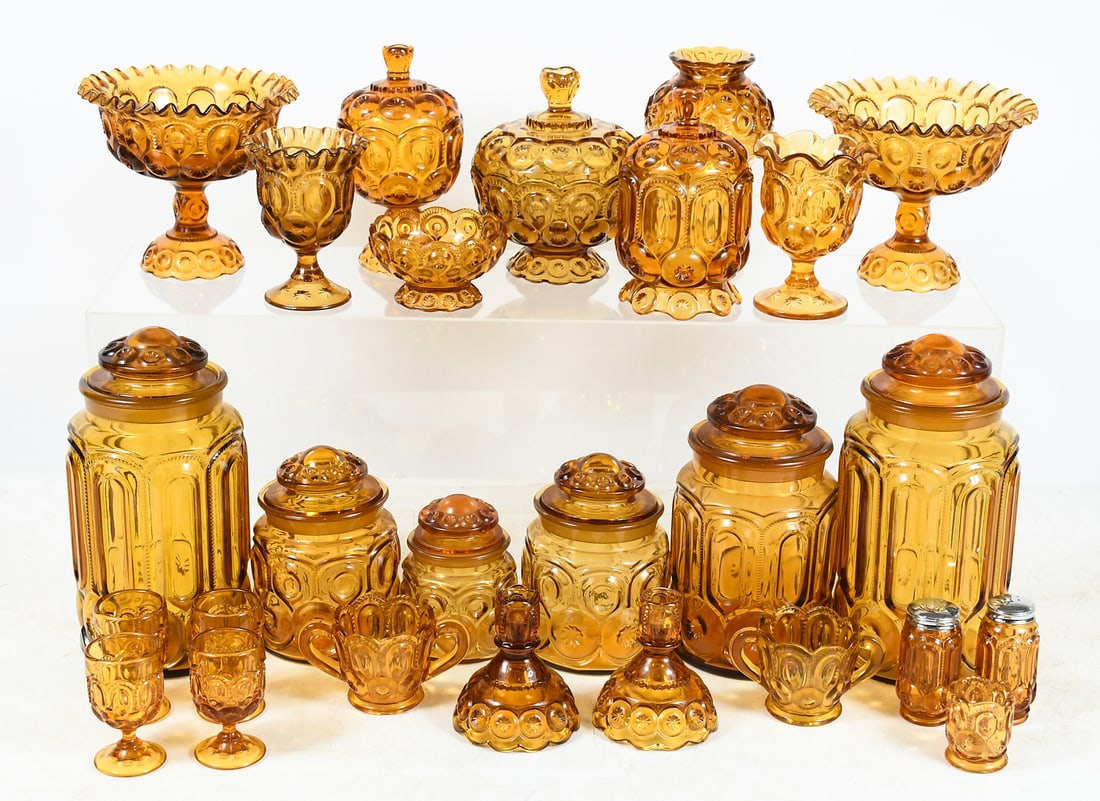26 PC. L.E. SMITH AMBER MOON & STAR GLASSWARE: 26 PC. L.E. SMITH AMBER MOON & STAR GLASSWARE: Canisters, goblets, cups, and lidded dishes in a warm gold color. Largest piece is a canister measuring 11.5" in height.