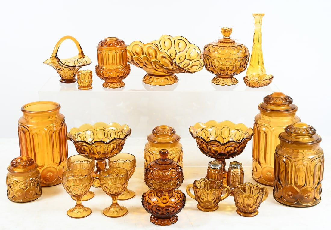 24 PC. L.E. SMITH AMBER MOON & STAR GLASSWARE: 24 PC. L.E. SMITH AMBER MOON & STAR GLASSWARE: Canisters, goblets, bowls, cups, lidded dishes and bride's baskets in a warm gold color. Largest piece is a canister measuring 11.5" in height.