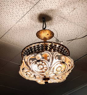 CRYSTAL & GILT METAL CHANDELIER: CRYSTAL & GILT METAL CHANDELIER: French style 3-Light Gilt metal & crystal beaded chandelier, having an overall scrolled design adorned by multi-faceted prisms. Ceiling mount with a raised foliate des