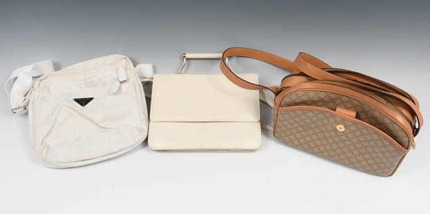 CELINE, CHARLES JOURDAN, & PRADA BAGS: CELINE, CHARLES JOURDAN, & PRADA BAGS: A Celine cross body bag in tan with two zippered areas and an outside pocket, a white Prada cross body with 3 zippered areas and inside pockets. Logo on the