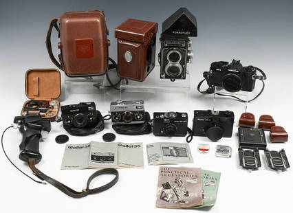 LARGE ROLLEI CAMERA COLLECTION & ACCESSORIES: LARGE ROLLEI CAMERA COLLECTION & ACCESSORIES: Camera collection includes a Rolleiflex T Model 2 (Serial #2162648). Complete with a Porroflex Prism Finder, leather and metal camera cases, hand trigger