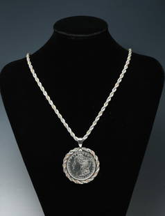 TIFFANY STERLING 18K CHAIN W/ 1884 COIN PENDANT: TIFFANY STERLING & 18K ROPE CHAIN W/ 1884 COIN PENDANT: Approx. 88.05 Grams total weight. Tiffany & Co. Sterling Rope chain with 18K intertwined at every other twist. An 1884 Morgan Dollar Pendant wit