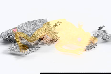 18K DIAMOND RUBY FROG BROOCH: 18K DIAMOND RUBY FROG BROOCH: A whimsical 18K yellow gold frog brooch contains 1 round brilliant cut diamond. WEIGHT: .04 Ct. Rated VS in clarity and G in color. One round mixed cut ruby. WEIGHT: .08