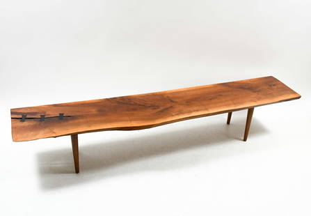 GEORGE NAKASHIMA STYLE LIVE EDGE WALNUT BENCH: GEORGE NAKASHIMA STYLE LIVE EDGE BENCH: A Nakashima style mid-century modern Black Walnut Bench with Rosewood Butterflies. Raised on tapered round legs. From Pennsylvania. If not George, possibly an u