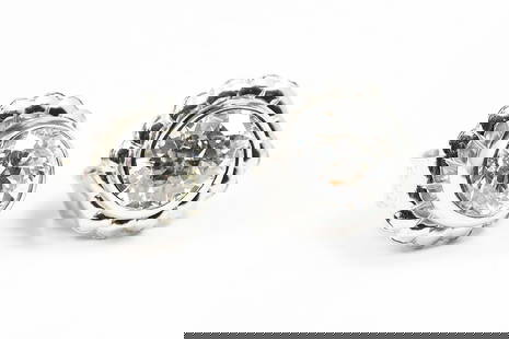 DIAMOND ART DECO PLATINUM STUDS: DIAMOND ART DECO PLATINUM STUDS: Platinum solitaire earrings contain 2 old European round cut diamonds. WEIGHT: 1.01 Ct. Approx. Rated SI1-SI2 in clarity and H in color. The diamonds are bezel set. Po