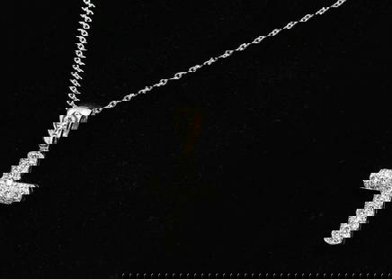 18K PLAT CHAIN & DIAMOND CROSS PENDANT: 18K PLAT CHAIN & DIAMOND CROSS PENDANT: 18K white gold diamond cross, contains 40-45 brilliant cut diamonds. Weight: approx. 5.2 grams. 18K suspended from a platinum chain approximately 18" in length.