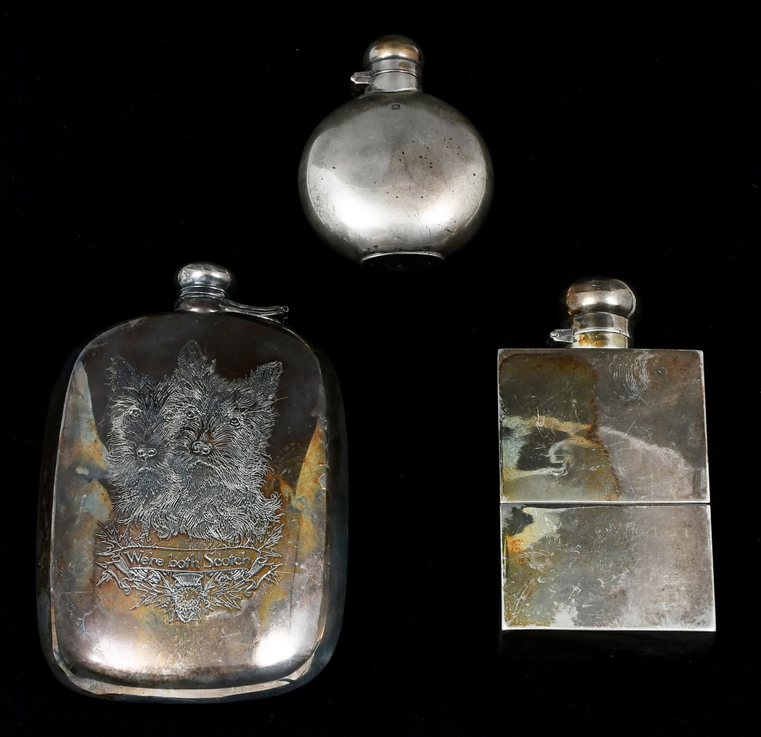 3 PC. STERLING SILVER FLASKS: 3 PC. STERLING SILVER FLASKS: Approx. 15.56 Troy ounces. Comprising; 1- William B. Kerr Flask with engraved Scotty Dogs with a Banner that reads, "We're Both Scotch". 1- English Flask with a Cup at th