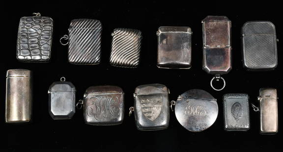 13 PC. ENGLISH STERLING MATCH SAFES / VESTA CASES: 13 PC. ENGLISH STERLING MATCH SAFES / VESTA CASES: Approx. 11.59 Troy ounces. Comprising; 1- Cornelius Saunders & Francis Shepard case with an engraved Coat of Arms. 1- Match safe with a compartment t
